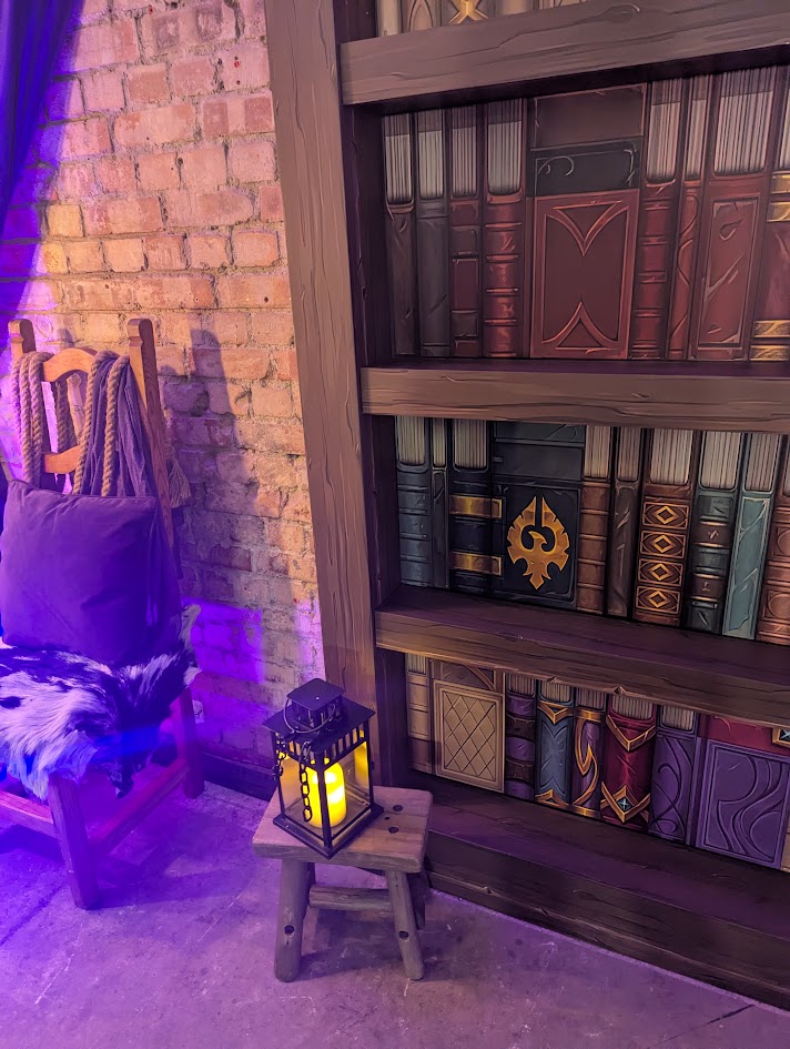 A photo of a lamp in front of a bookcase